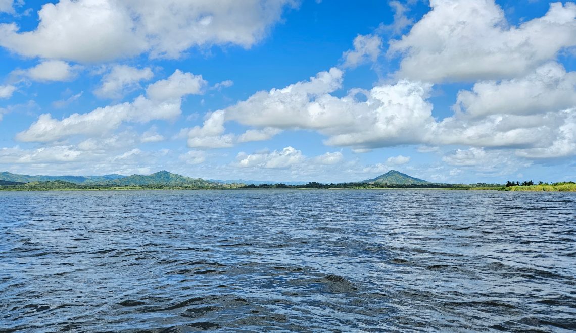 Panoramic view of Laguna Limón with mountain peaks and lush green countryside in Miches Dominican Republic